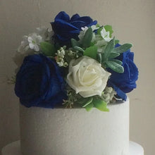 A cake topper of artificial roses (choice of colours)