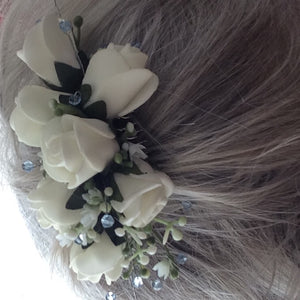 a floral hair comb featuring ivory roses & crystals