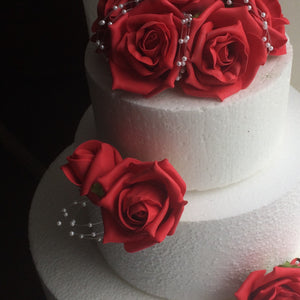 cake decorations of artificial foam roses and pearls