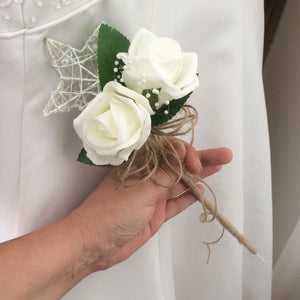 A bridesmaids star wand with ivory roses & hessian handle