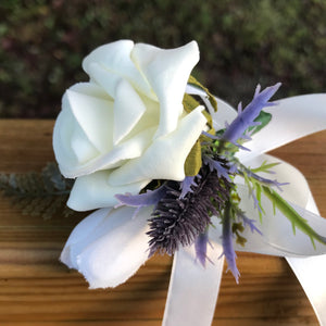 childs wrist corsage - featuring an artificial foam rose and thistle head