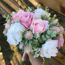 wedding bouquet of pink flowers including thistles and gyp