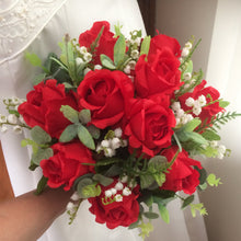 A wedding bouquet and buttonhole collection of artificial roses