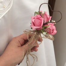 A dainty bridesmaids wand with pink roses, gyp & jute handle