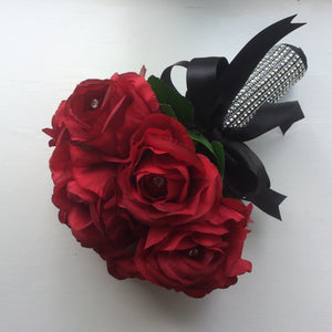a brides bouquet of artificial silk red roses with diamante