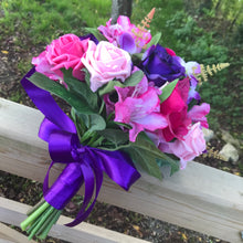a wedding bouquet of artificial silk cerise purple and pink flowers