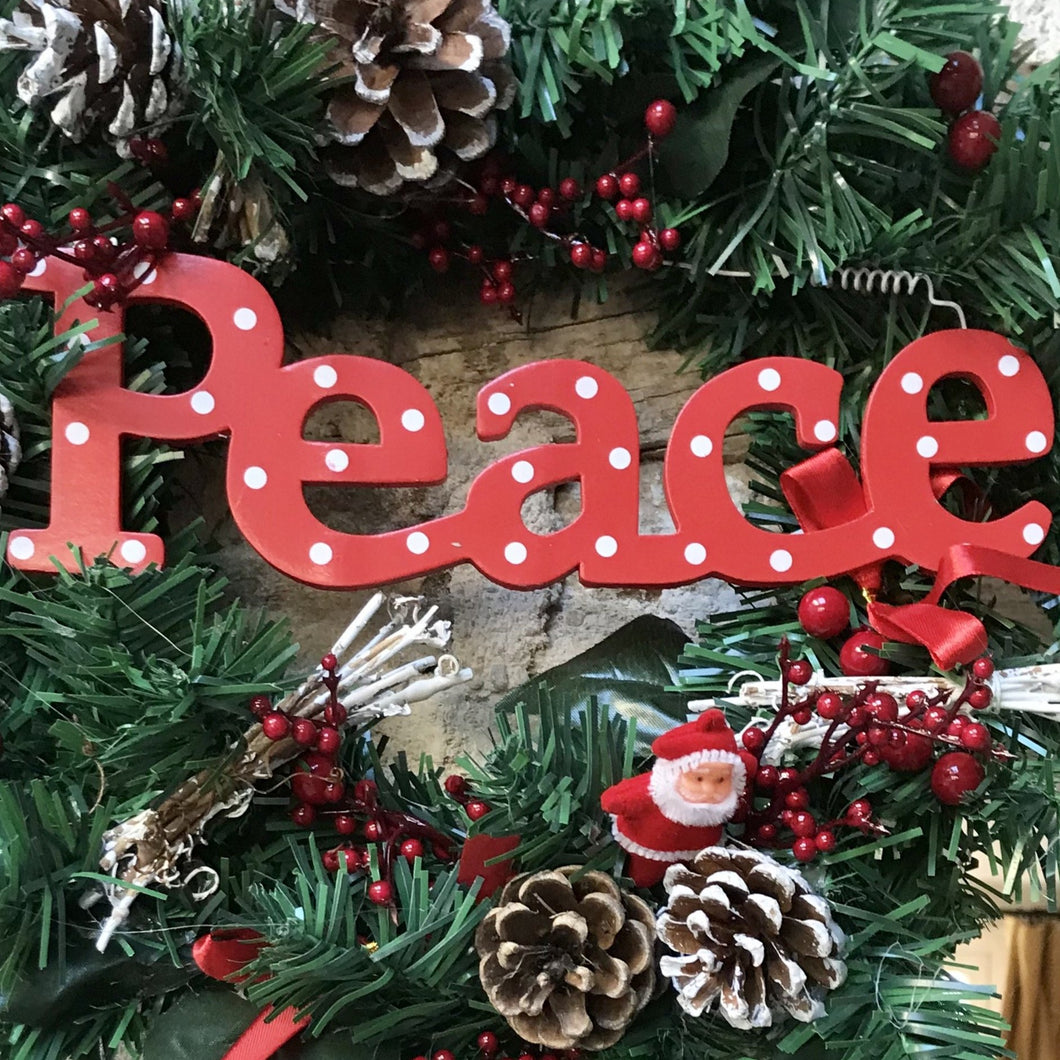 red and white PEACE christmas sign