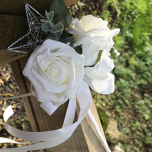 A teardrop wedding bouquet collection of artificial ivory roses