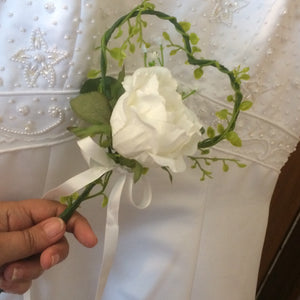 A bridesmaids rustic heart shaped wand with single ivory rose
