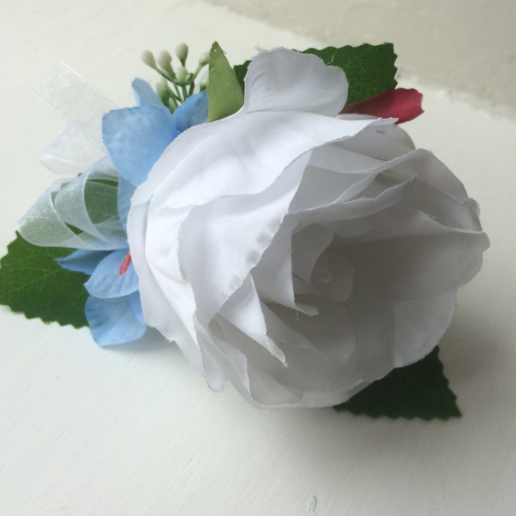 a white rose buttonhole