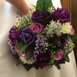 a bridal bouquet of purple and lilac flowers