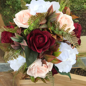 A bridesmaids or small brides bouquet featuring burgundy, mocha & white flowers