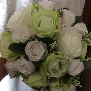 A wedding bouquet of green and white artificial silk roses