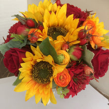 a brides wedding bouquet featuring artificial silk roses & sunflowers