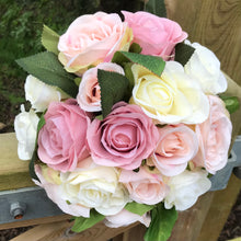 A wedding bouquet of artificial silk dusky pink and blush roses