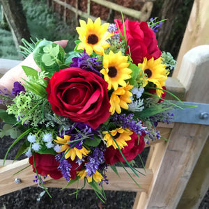 A bouquet collection featuring red, yellow and purple artificial silk flowers
