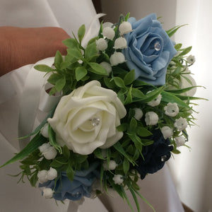 a wedding bouquet collection of roses and lily of the valley