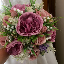 A bouquet collection of ivory dusky pink and mauve artificial silk flowers