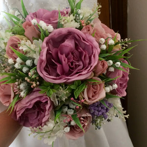 A bouquet collection of ivory dusky pink and mauve artificial silk flowers