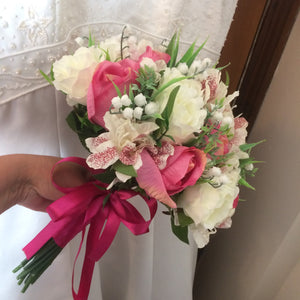 a wedding bouquet of artificial roses, astromeria & lily of the valley