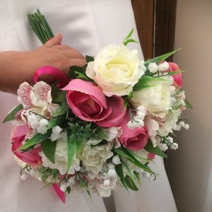 a wedding bouquet of artificial roses, astromeria & lily of the valley