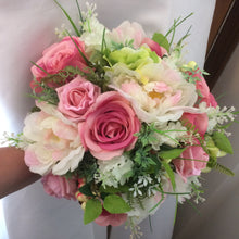 artificial wedding bouquet of pink silk flowers