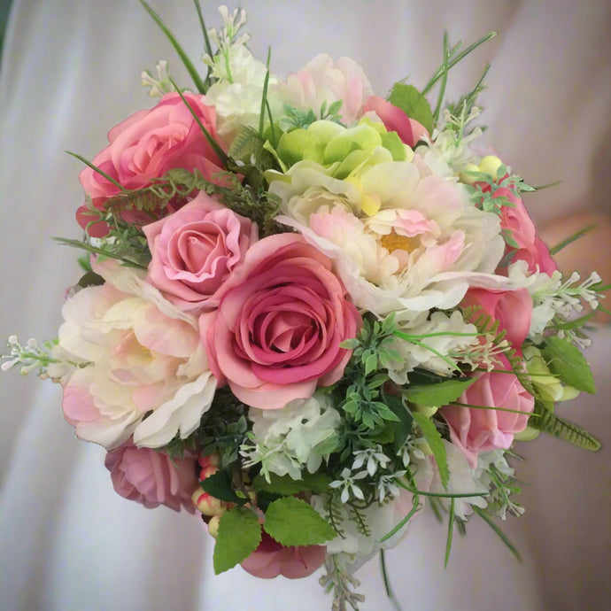 artificial wedding bouquet of pink silk flowers