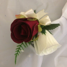 A collection of wedding bouquets featuring ivory and burgundy roses