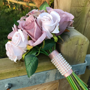 A wedding bouquet collection of dusky pink and nude roses