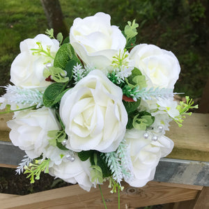 A teardrop bouquet collection of ivory roses and eucalyptus