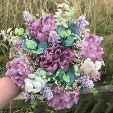 wedding bouquet of dusky pink and mauve  flowers