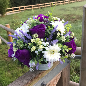 an arrangement of lilac, purple and ivory silk flowers
