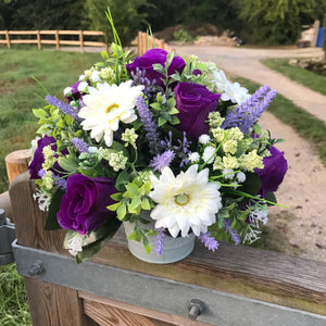 an arrangement of lilac, purple and ivory silk flowers
