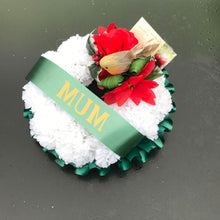 A christmas memorial based posy wreath of red roses, poinsettia & a robin