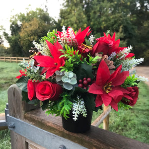 A Christmas memorial flower graveside arrangement