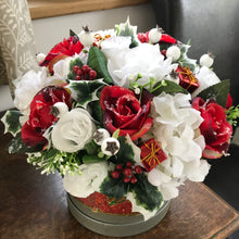 christmas flower arrangement in hat box