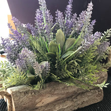 natural looking artificial silk lavender arranged in log container