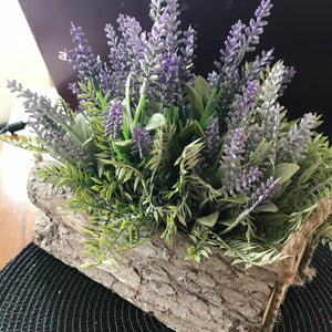 natural looking artificial silk lavender arranged in log container