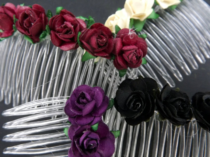Clear plastic hair comb decorated with dainty artificial roses