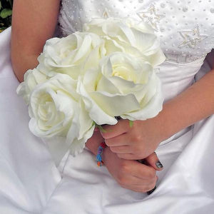 A wedding bouquet of artificial silk ivory roses