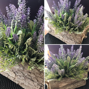 natural looking artificial silk lavender arranged in log container