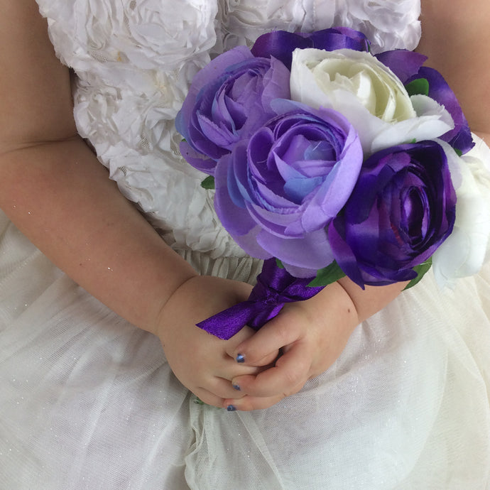 Flower girls posy of purple ivory ranaculus