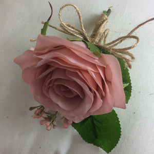 silk wedding buttonhole features dusky pink rose