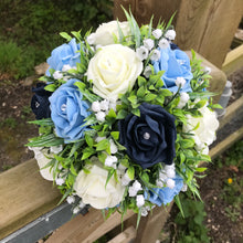 a wedding bouquet collection of roses and lily of the valley
