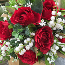 a wedding bouquet collection of red roses & White lily of the Valley