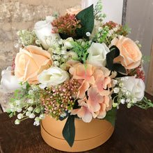 peach hat box flower arrangement