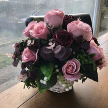 dusky pink and burgundy flower arrangement