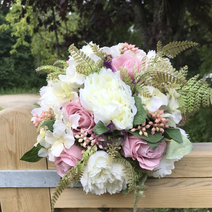 wedding bouquet of roses and peonies