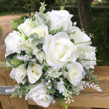 A teardrop bouquet collection of ivory roses and eucalyptus