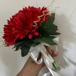 a bridesmaids simple posy bouquet design of red gerberas